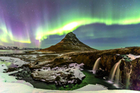 Icelandic tholos with northern lights in background, taken from web