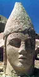 Image of a giant head taken from a postcard of the heads at Nemrut Kommagene in Turkey; it's been identified as Apollon-Mithras-Helios  but in the PHANTACEA Mythos it's more reminiscent of Thrygragos  Lazareme